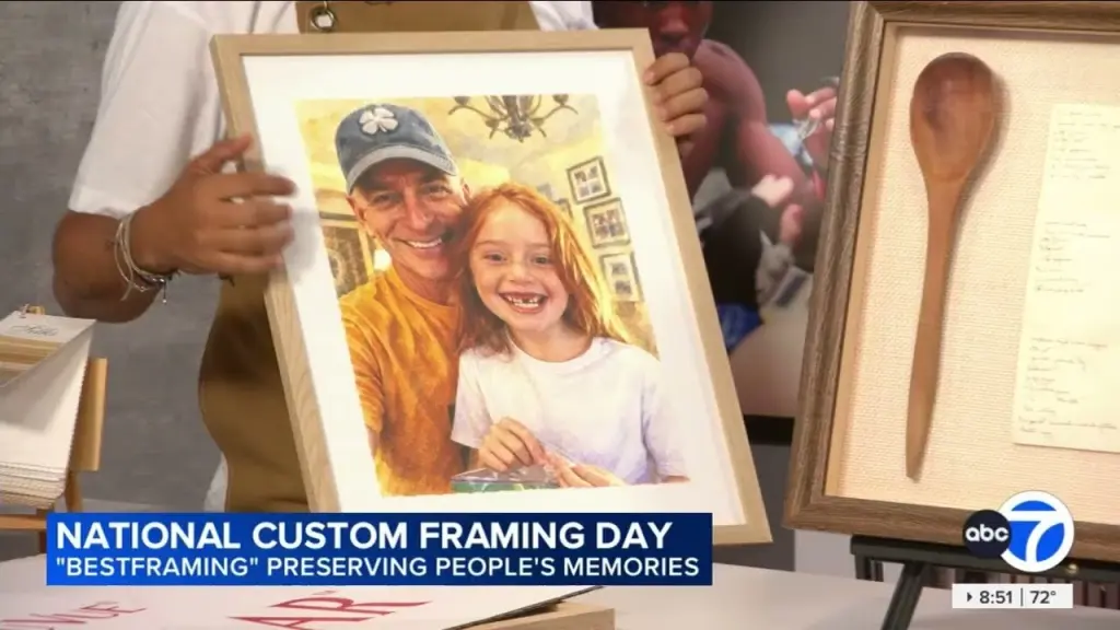 On the ABC7 News set: a framed painted portrait of a man and a young girl beside a shadow box with a wooden spoon, under the on-air title National Custom Framing Day, Best Framing preserving people’s memories