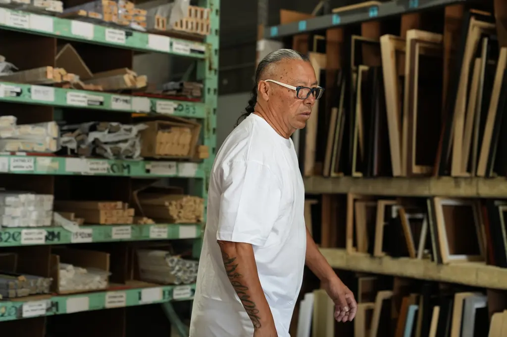 A framer pulling moulding from the stock racks