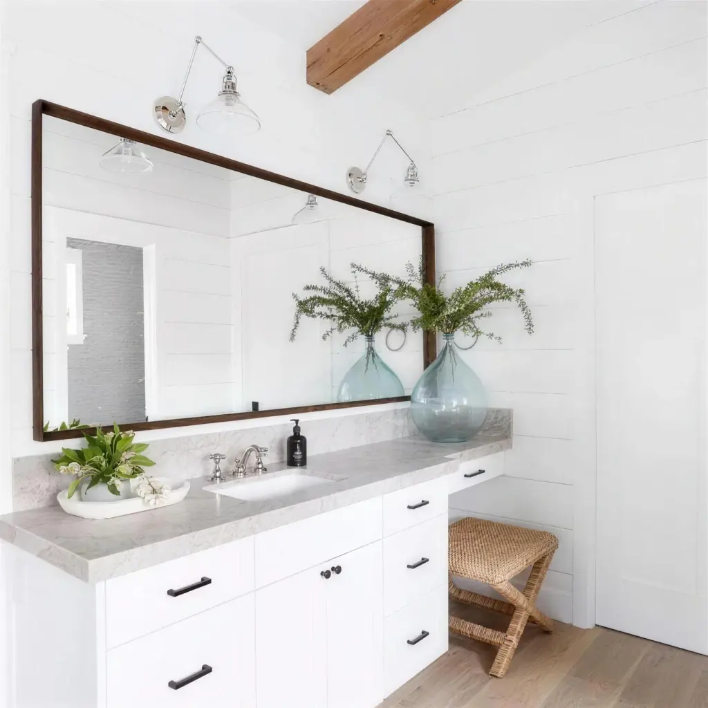 wide dark walnut framed mirror on white shiplap, stone counter